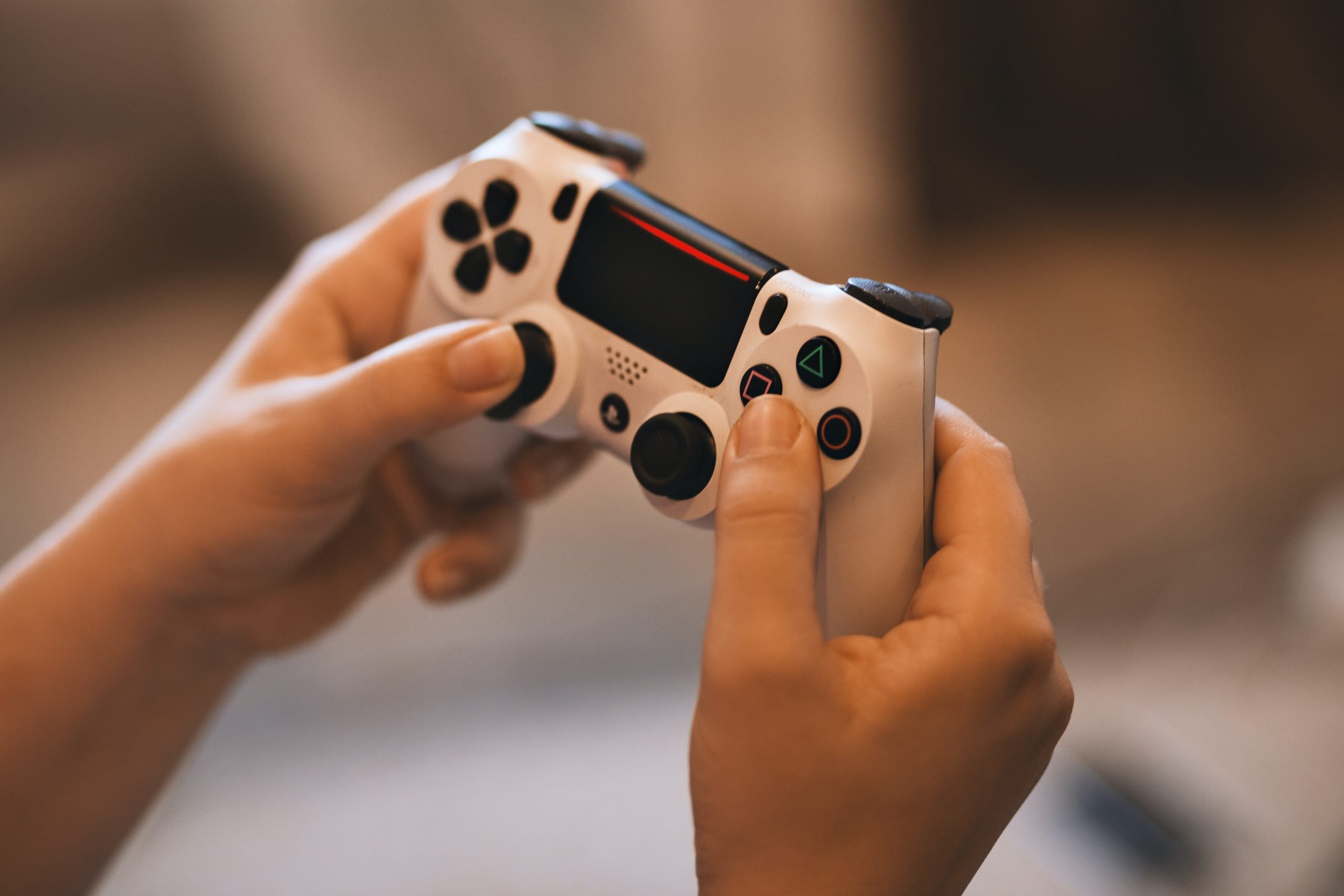 Person Holding Sony Ps4 Controller Â· Free Stock Photo