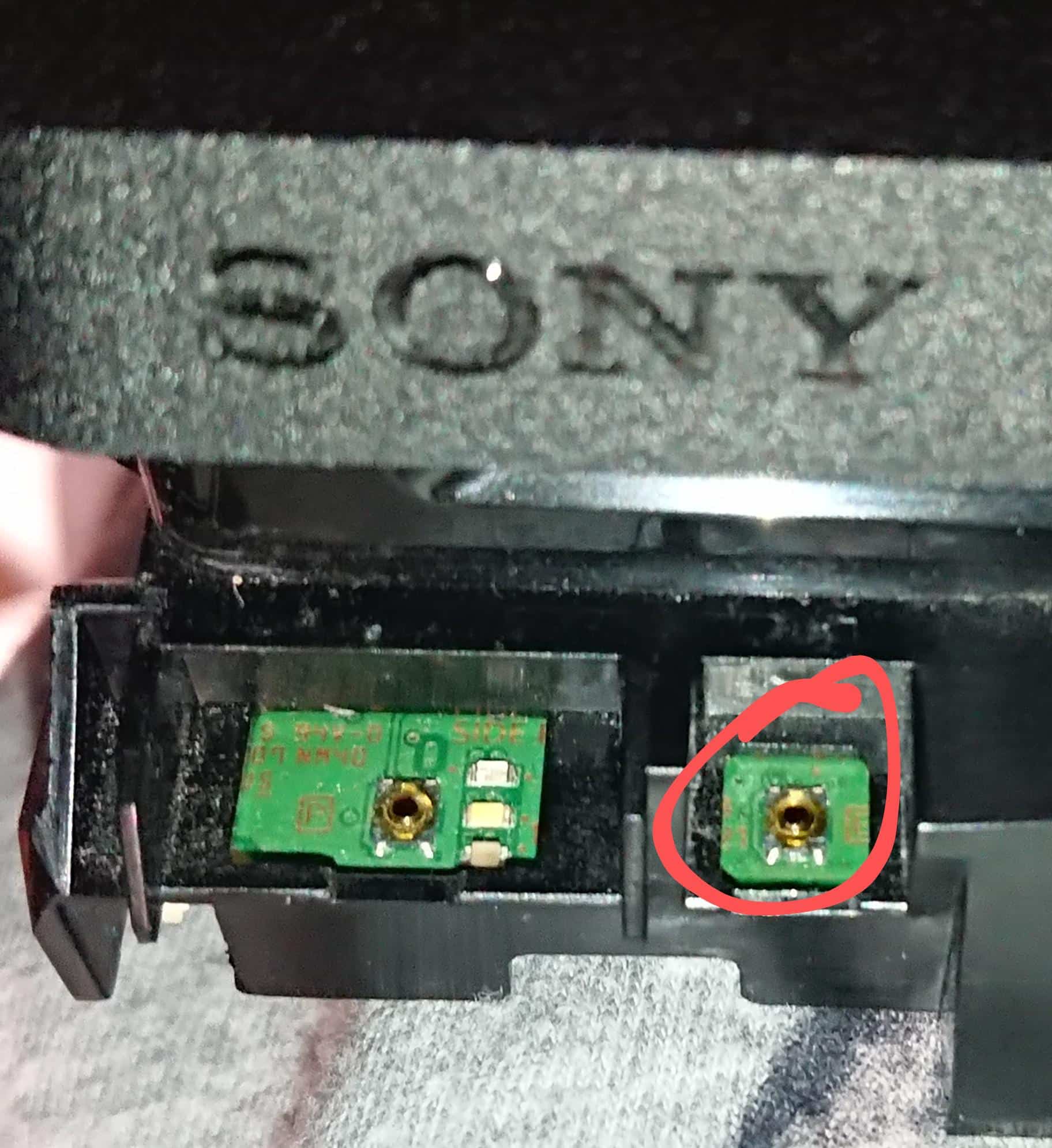 The disc that sits on top of PS4 Slim eject button became unstuck and ...